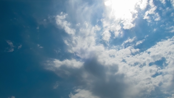 Clouds Moving In The Blue Sky. alt