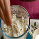 Woman Measures Spices into a Bowl of Flour - VideoHive Item for Sale