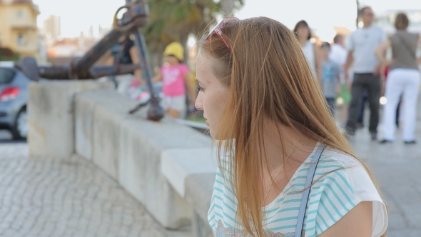 Serious Girl Thinking In a City Embankment Sitting alt