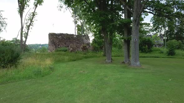 Medieval Castle Ruins in Latvia Rauna. Aerial View Over Old Stoune Brick Wall of Raunas Castle  alt