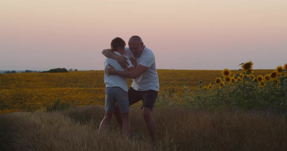 A Father Trains His Son In Boxing