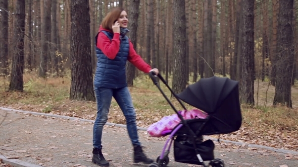 Phone Conversation In Autumn Park alt