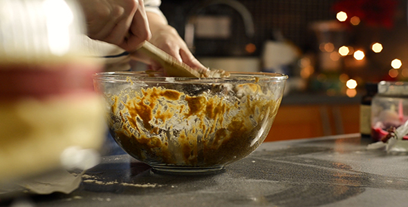 Woman Mixes Wet and Dry Ingredients in Large Bowl
