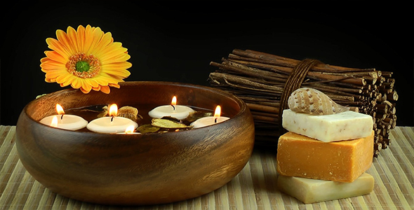 Spa Treatment with Candles and Yellow Flower