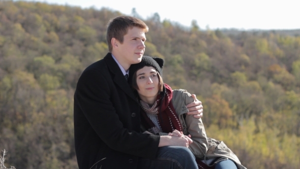 Couple In The Mountains Enjoying Life And Talking