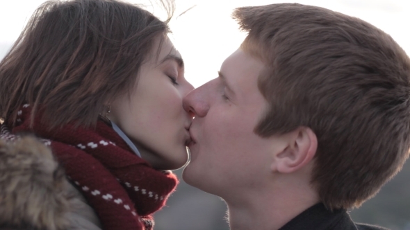 Lovely Young Couple Kissing In The Outdoors