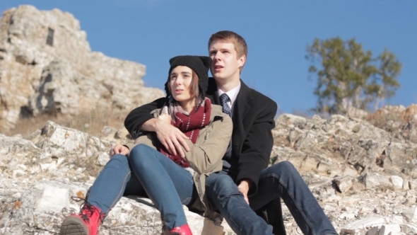 Couple In The Mountains Enjoying Life And Talking