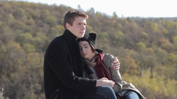 Couple In The Mountains Enjoying Life And Talking