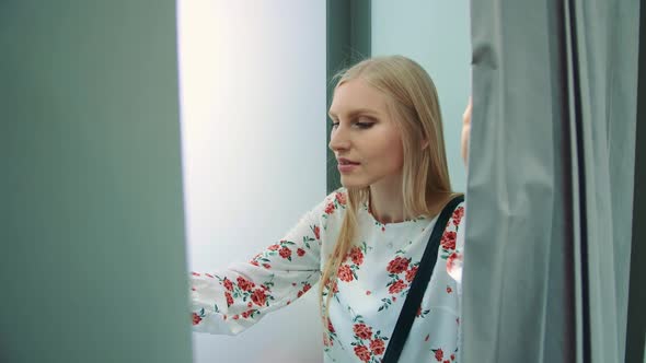 Funny Cheerful Girl in Photo Booth Posing for Camera Having Fun Doing Series of Photo alt