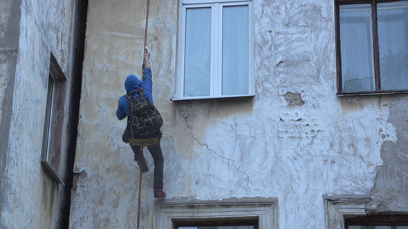 Climber Goes Up On Old Building