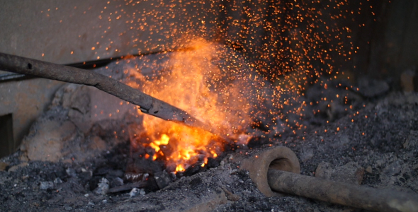 Blacksmith Warming Iron In The Fire alt