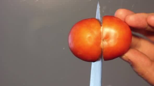 Cutting Tomato on the Glass