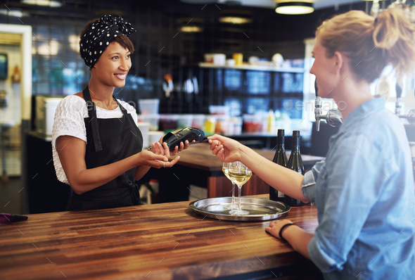 Customer paying with a credit card - Stock Photo - Images