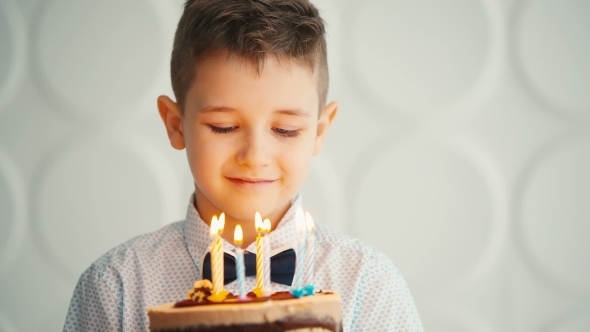 Little Boy Blowing Out Candles On Birthday Cake, Stock Footage | VideoHive