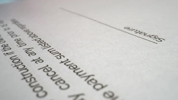 Businessman sign signature on document contract paper at office desk alt