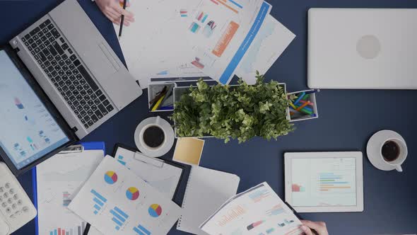 Top View Timelapse of Businesswomen Sharing Company Financial Paperwork Working in Startup Office alt