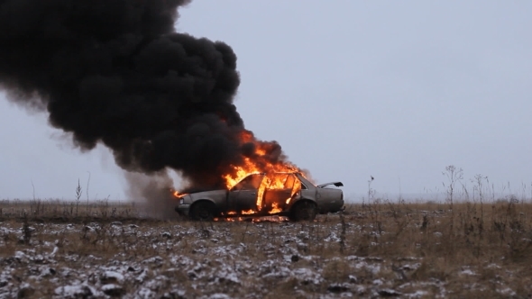 Car On Fire On An Ampty Field