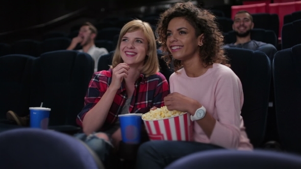 Woman Eating Popcorn And Watching Movie alt