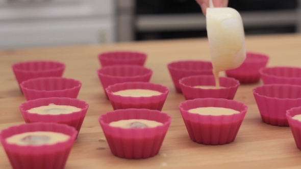 The Process Of Preparing Cupcakes In The Kitchen