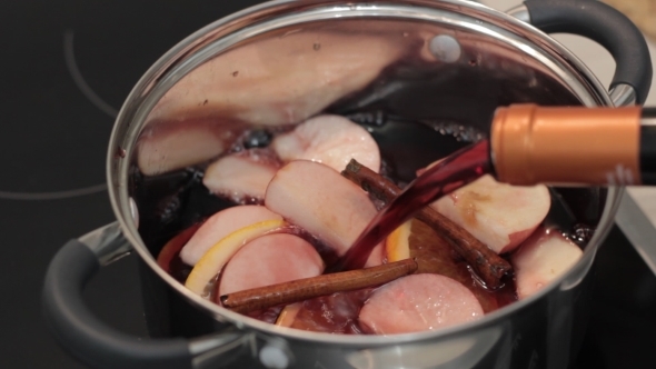 Mulled Wine Cooks With Orange And Apple