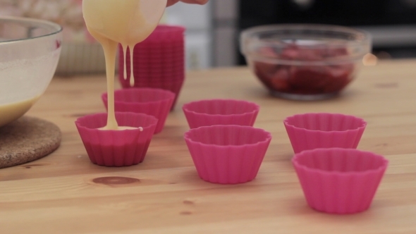 The Process Of Preparing Cupcakes In The Kitchen