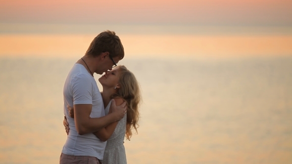 Happy Newlywed Couple At Sunrise