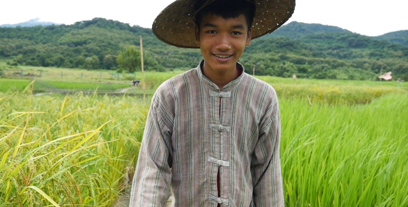 Asian Farmer Walking And Smile alt