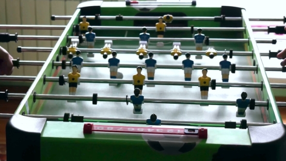 Table Football Game With Yellow And Blue Players
