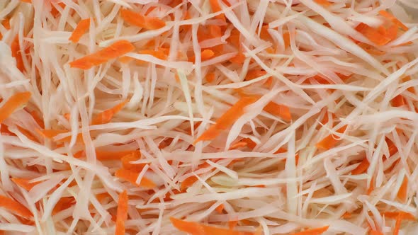 vegetables salad with sliced white cabbage and carrot alt
