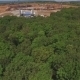 Drone Flies To Building Of Large Stadium From Forest - VideoHive Item for Sale