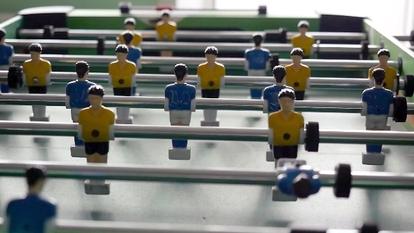 Table Football Game With Yellow And Blue Players