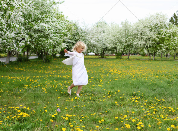 little girl in spring park - Stock Photo - Images