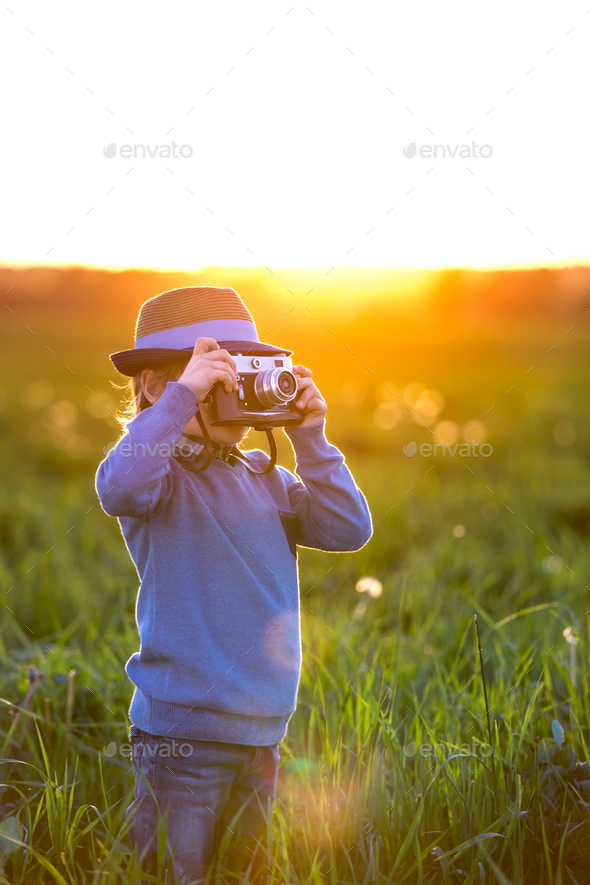 Boy with camera - Stock Photo - Images