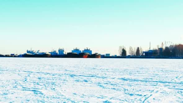 Ships in Port on Frozen Lake in Winter