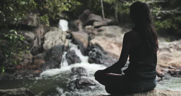 Silhouette Girl Meditating Thai Waterfall in Than Sadet Nature Reserve