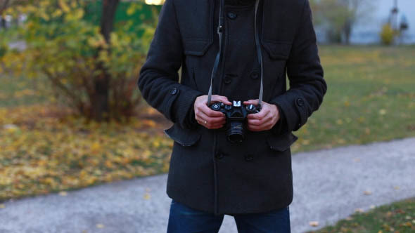 Man Photographs Retro Camera alt