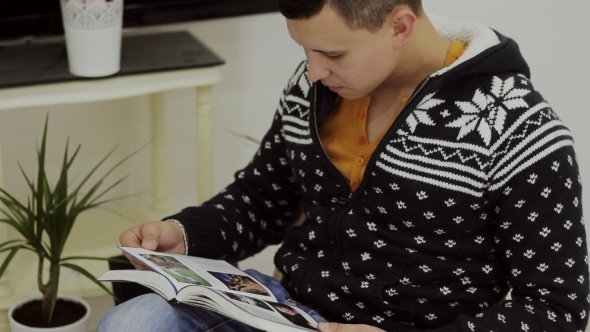 Handsome Young Man Reading a Book