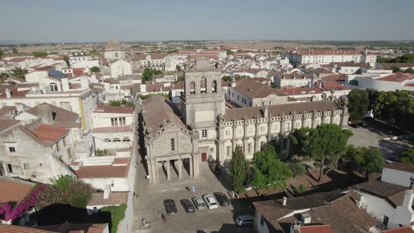 Aerial circling around Our Lady of Grace or Igreja da Graca church of Evora in Portugal