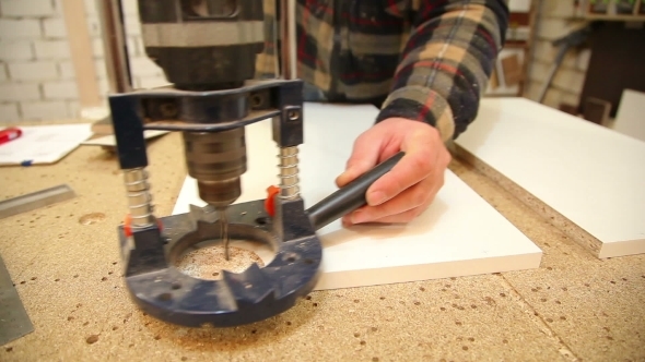 Carpenter Drill Holes With a Drill