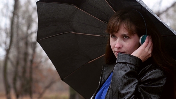 The Woman In The Rain Listens To Music alt