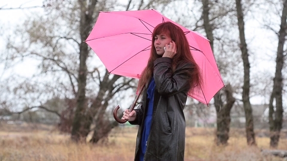 The Woman With Phone In a Raincoat alt