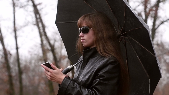 The Woman With Phone In a Raincoat alt