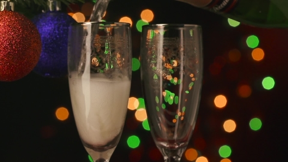 Two Champagne Glasses With Pouring Champagne Ready