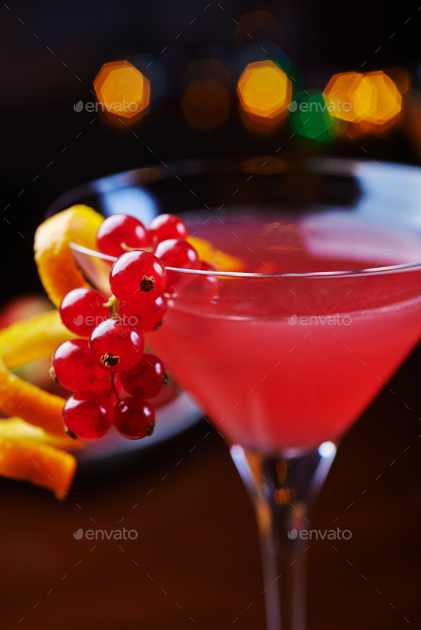 bright glass of alcoholic cocktail or lemonade on a table in a bar. soft focus. - Stock Photo - Images