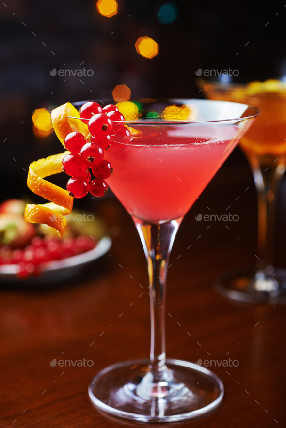 bright glass of alcoholic cocktail or lemonade on a table in a bar. soft focus. - Stock Photo - Images