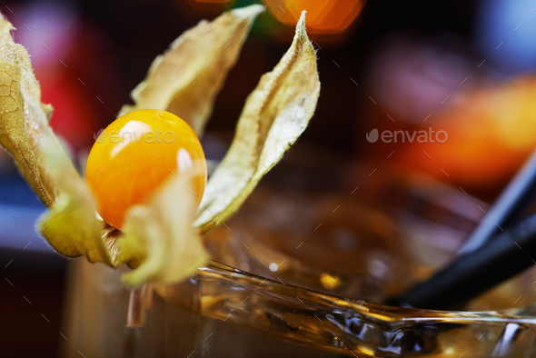 bright glass of alcoholic cocktail or lemonade on a table in a bar. soft focus. - Stock Photo - Images