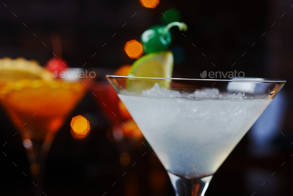 bright beautiful bright glass of alcoholic cocktail or lemonade on a table in a bar. soft focus. - Stock Photo - Images