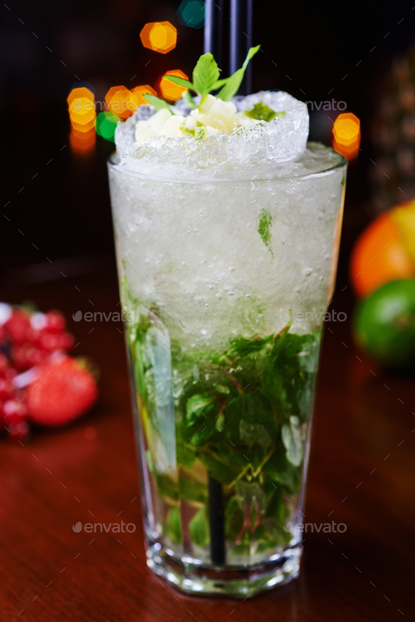 bright beautiful bright glass of alcoholic cocktail or lemonade on a table in a bar. soft focus. - Stock Photo - Images