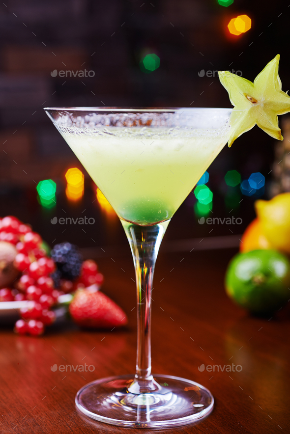 bright beautiful glass of alcoholic cocktail or lemonade on a table in a bar. soft focus. - Stock Photo - Images
