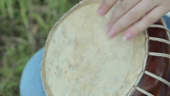 Women Playing On Jambe Drum On Nature alt